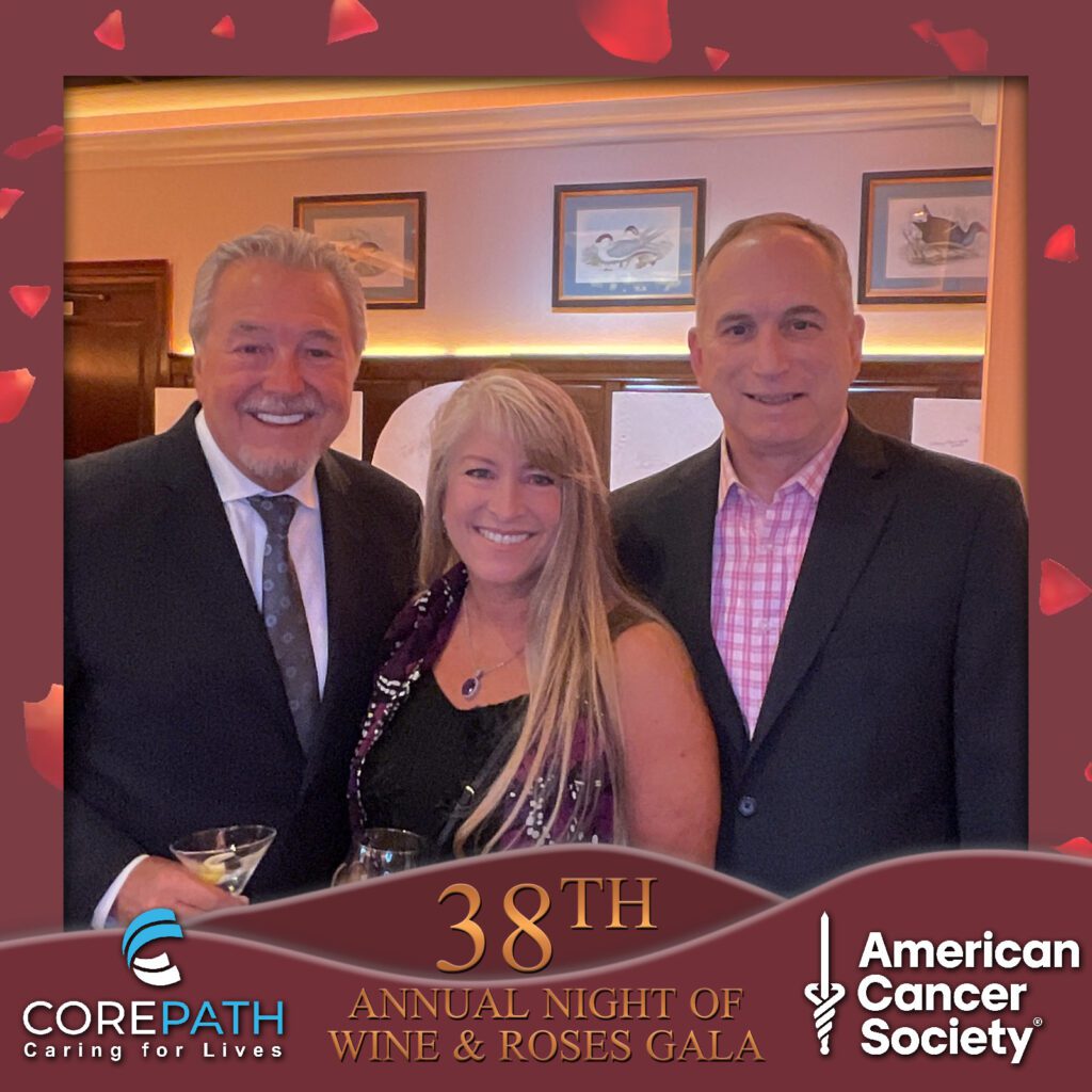A group of men and a women celebrating at the photo booth.
