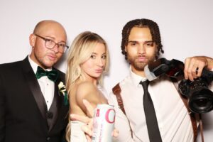 A group of friends posing confidently holding a camera at Milestone NJ