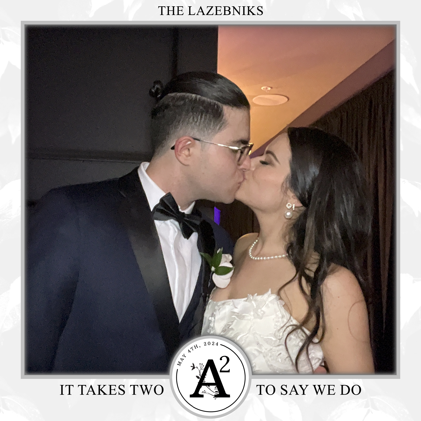 A bride and groom sharing a moment at our photo booth.