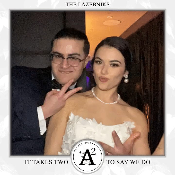 A bride and groom sharing a moment at our photo booth.