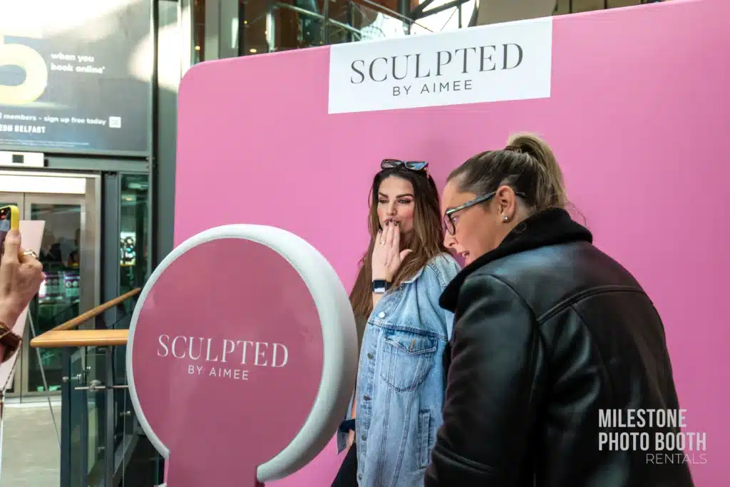 Branded corporate photo booth activation for Sculpted by Aimee event marketing and guest engagement