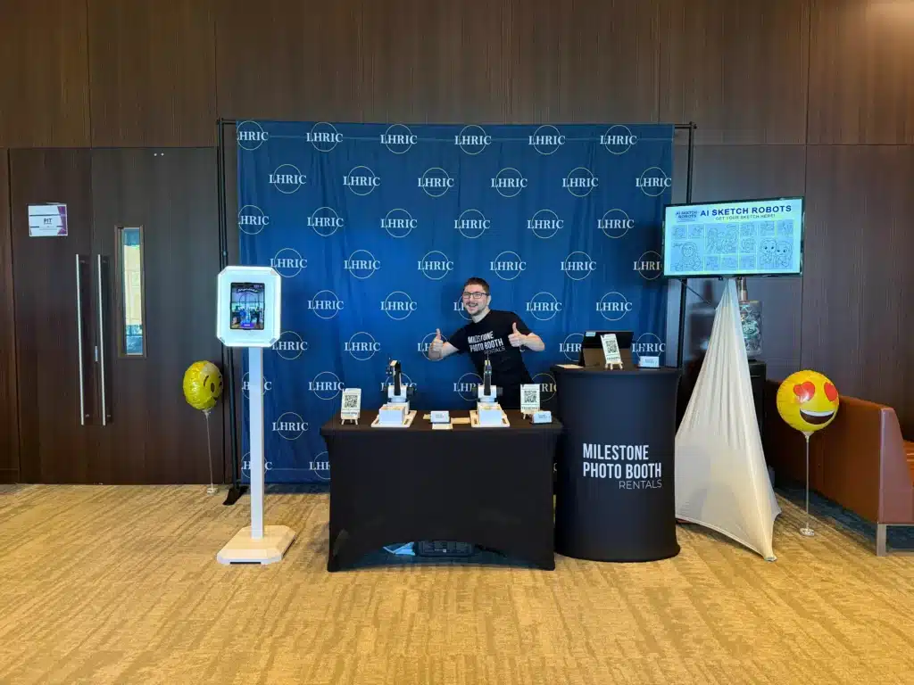 Milestone Photo Booth Rentals team member at the AI Sketch Robots vendor booth at the LHRIC TLI Tech Expo 2026 at Windrose on Hudson.