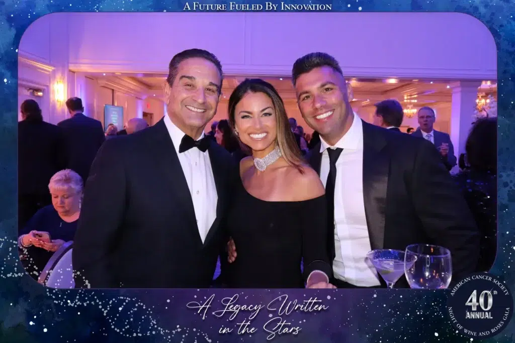 Guests posing for a roaming photo at the American Cancer Society 40th Annual Night of Wine and Roses Gala at The Palace at Somerset