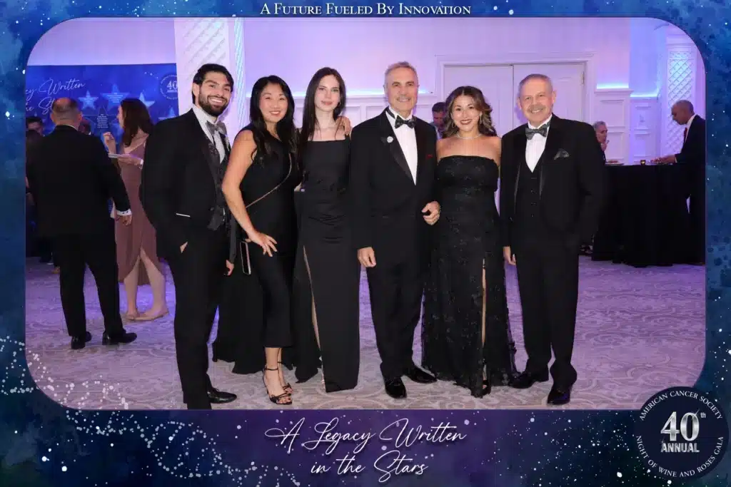 Guests posing for a Roamer Pro photo at the American Cancer Society 40th Annual Night of Wine and Roses Gala at The Palace at Somerset