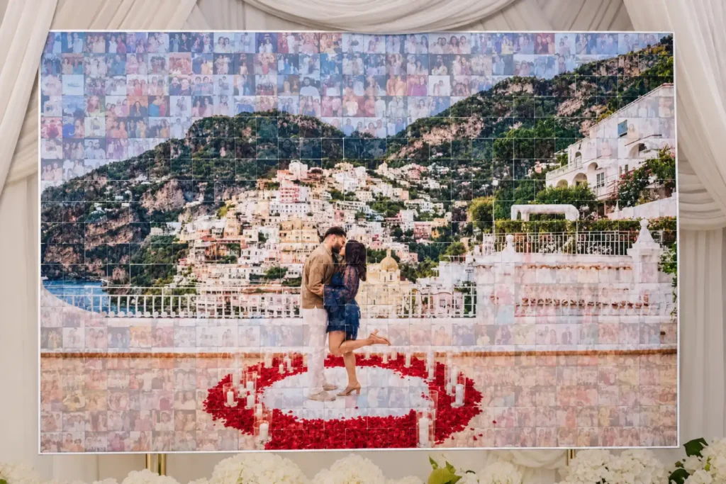 Finished live photo mosaic wall for engagement party made of 600 guest photos forming the couple's engagement kiss on a terrace in Italy